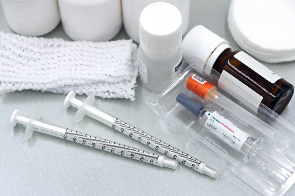 Syringes with gauze, needles, and medications