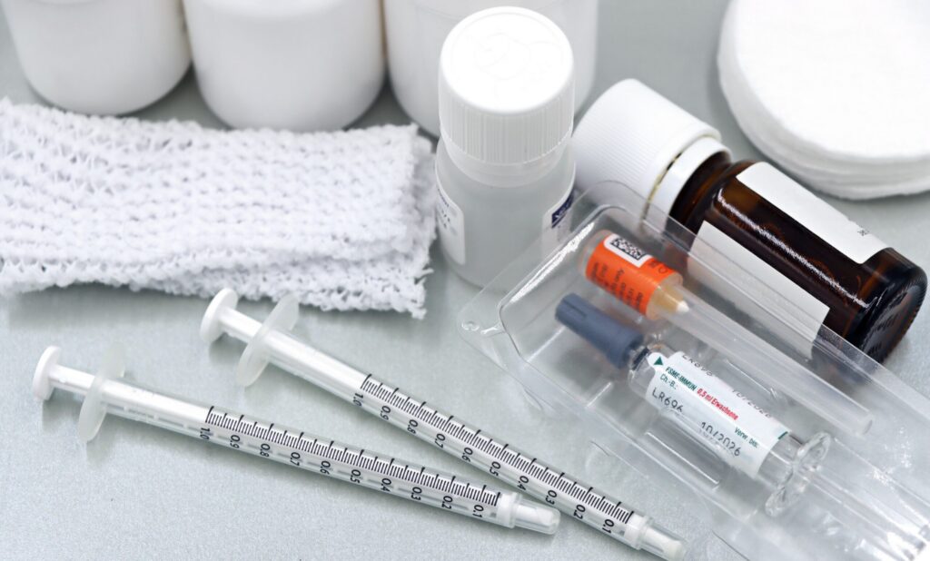 Syringes with gauze, needles, and medications