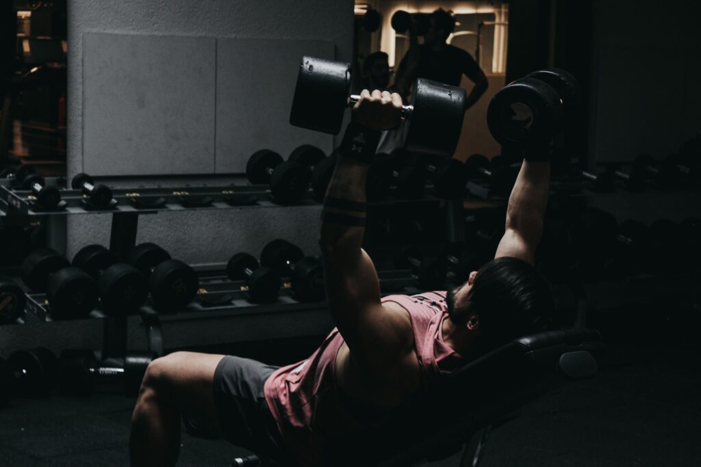 Man lifting dumbbells in the gym