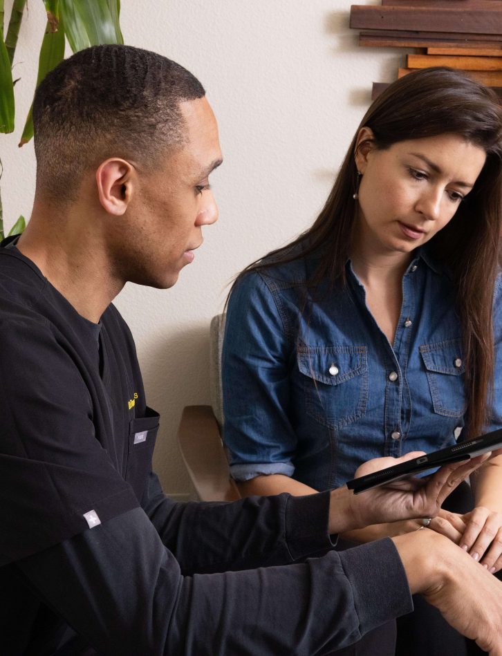 Dr. Hughes talking to a woman patient